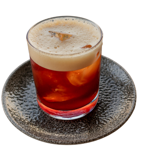 Carajillo cocktail on dark plate